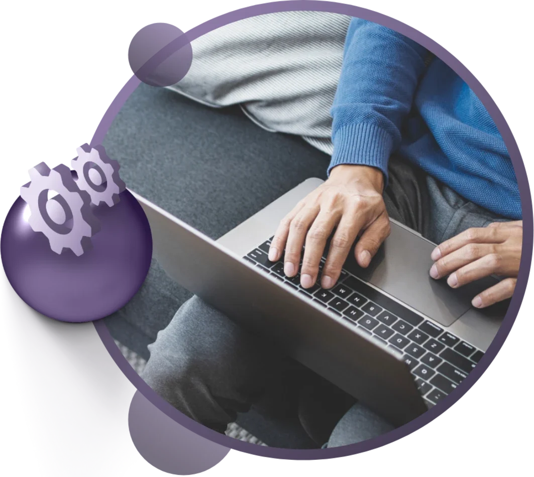 Person typing on a laptop with hands visible, accompanied by a graphic of gears in a circular design.