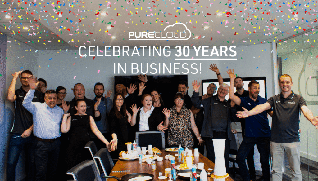 Photo of the Pure Cloud team celebrating 30 years of businesses!
